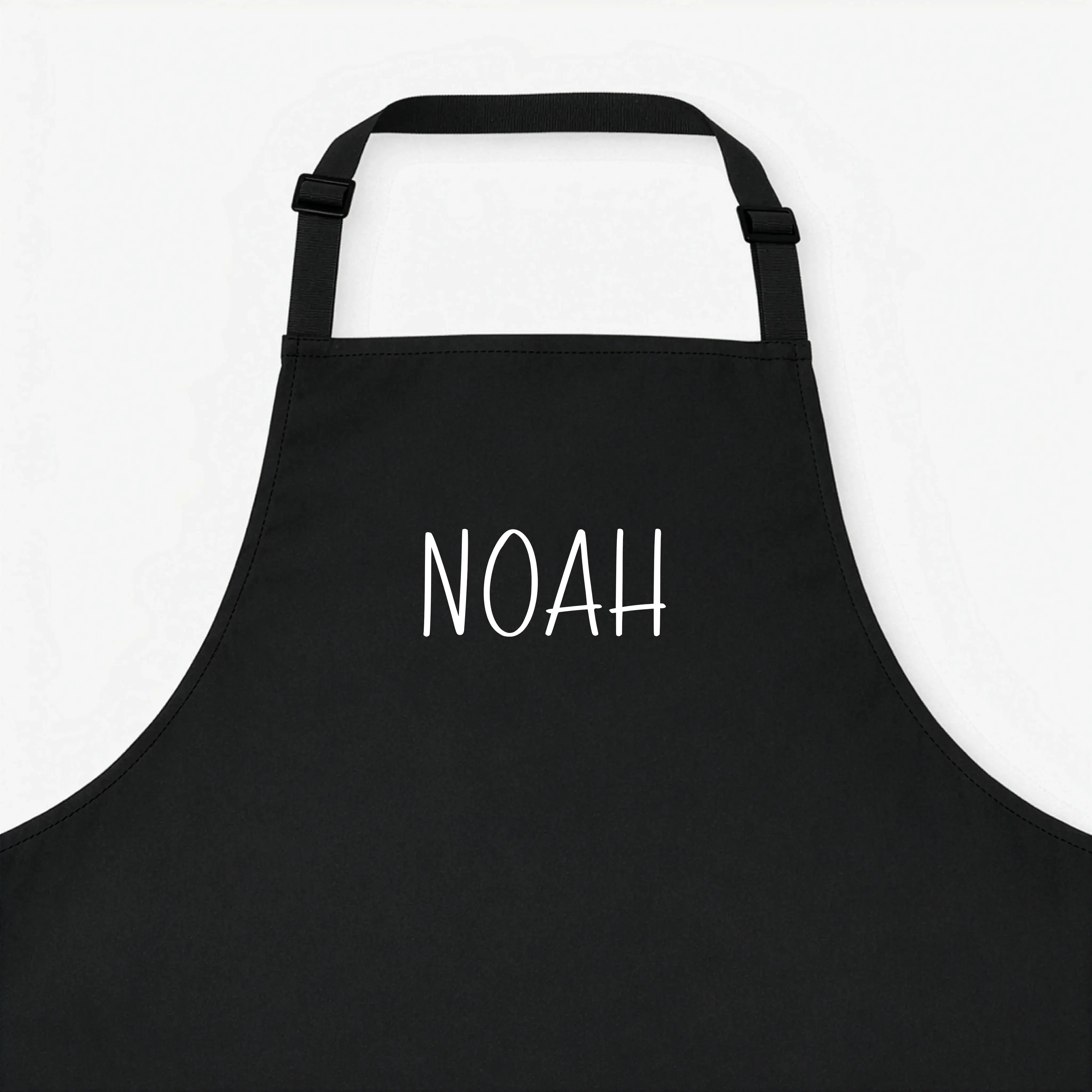 Kochschürze mit Namen-Kochschürze-famprints-Eine Kochschürze mit Namen macht aus jedem Kochmoment etwas Persönliches. Bei famprints gestaltest du deine personalisierte Kochschürze genau so, wie sie zu dir oder zur beschenkten Person passt. Ob dezente Schr